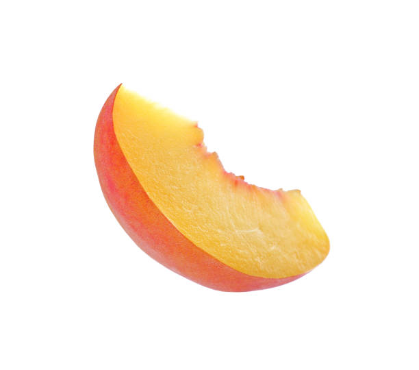 istock Slice of ripe peach isolated on white 1359963047