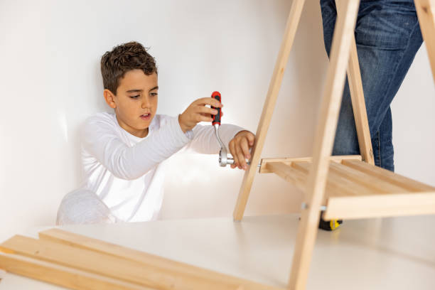 istock Father and son assembling made furniture 1359963150