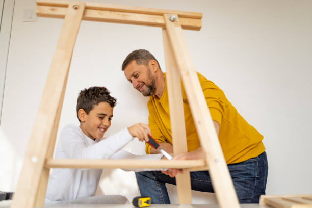 istock Father and son assembling made furniture 1359964068