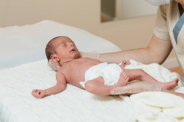 istock Professional physiotherapist working with a newborn baby. 1359964310