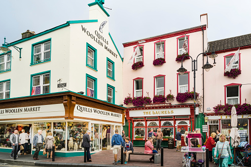 View of a busy shopping street in the centre of the Irish town of Killarney. Concept of tourism, travel and street life.