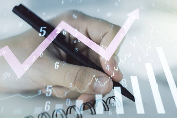 istock Abstract creative financial graph with upward arrow and man hand writing in notebook on background, forex and investment concept. Multiexposure 1359965325