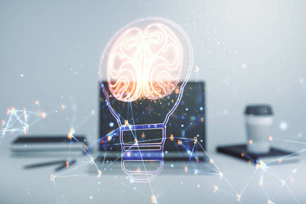 istock Double exposure of creative light bulb hologram with human brain on laptop background, idea and brainstorming concept 1359965403