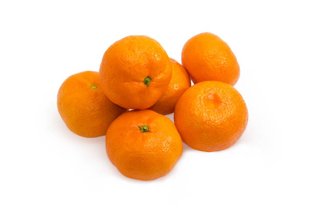 istock Heap of tangerines on a white background 1359967237