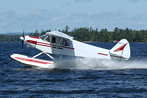 Piper PA-18 Super Cub Floatplane, departing the Greenville Seaplane Base, Greenville, Maine.  September 2021.