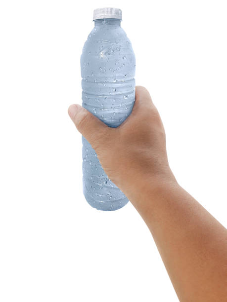 istock Man holding a bottle of water isolated on white background 1359971590