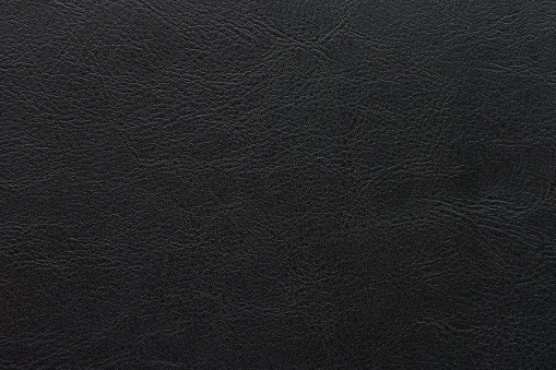Black leather texture macro close up view. Surface of animal skin