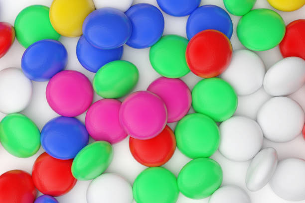 istock Multi-colored tablets of medicines, scattered on the table. 1359973936
