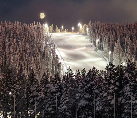 Levi Ski Resort at night in winter under the Moon