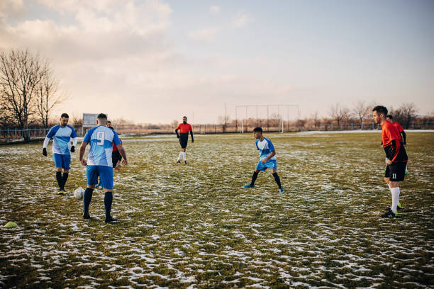 istock Soccer match on winter day 1359976344