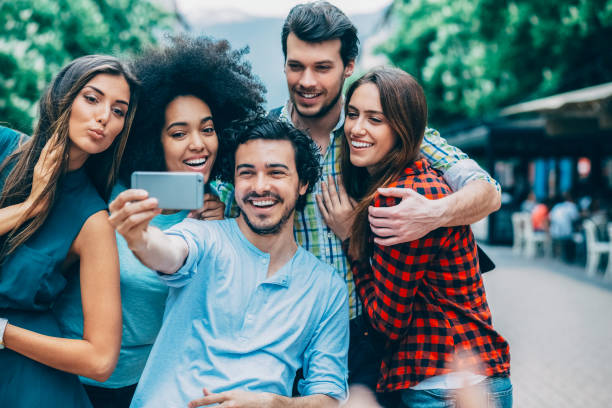 istock Young people taking selfie at the street 1359979166