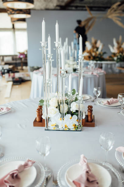 istock Luxurious restaurant. Luxurious interior, white tables, serving dishes and glasses for guests 1359979544