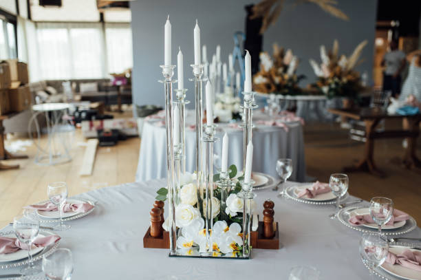 istock Luxurious restaurant. Luxurious interior, white tables, serving dishes and glasses for guests 1359979559