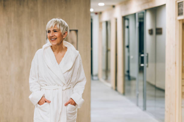 istock A Beautiful Senior Woman Wearing Her White Bathrobe While Being At A Spa Center 1359979716