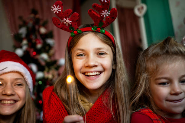 istock Happy sisters having fun at Christmas 1359981036