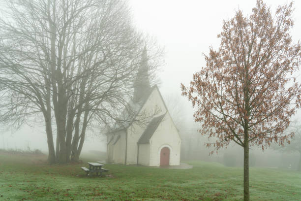 istock Desert Chapel in Gooik whit fog 1359983286