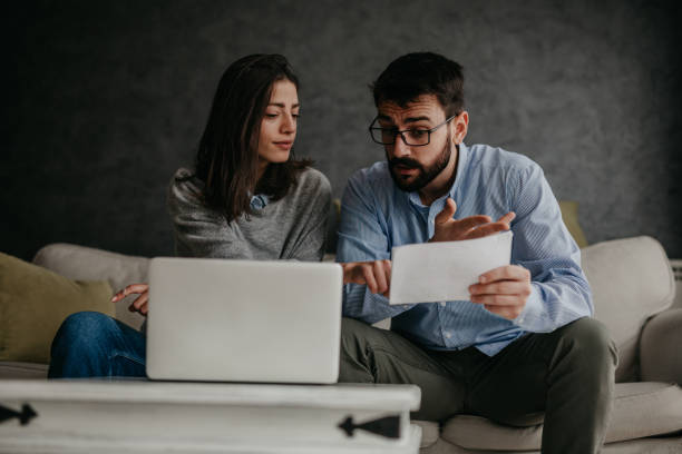 istock Paying bills and checking home finances 1359983926