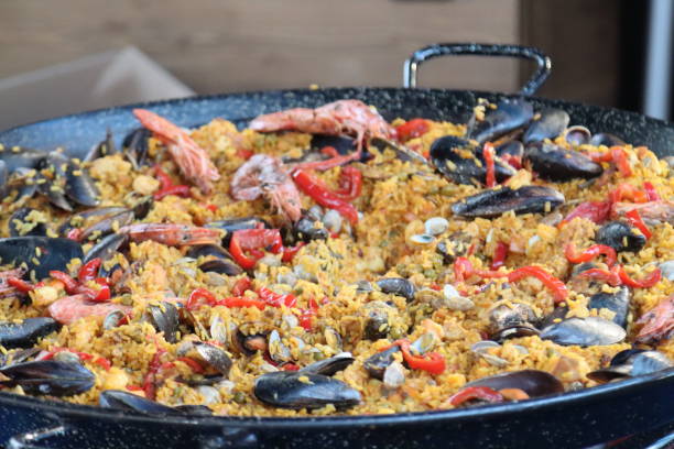 istock fish and rice paella to cook in a pan 1359984429
