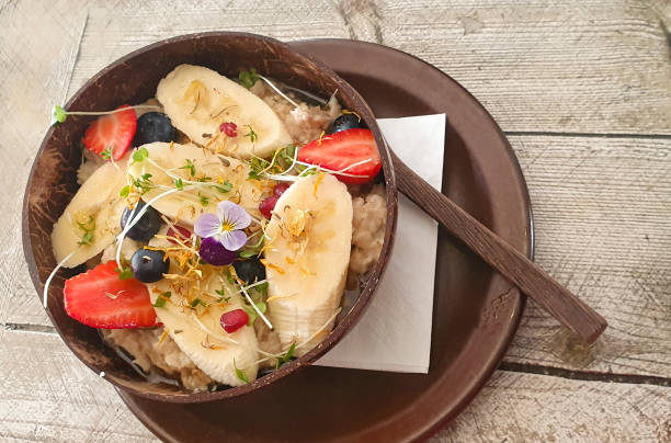 istock Porridge in a bowl with fruit 1359985226