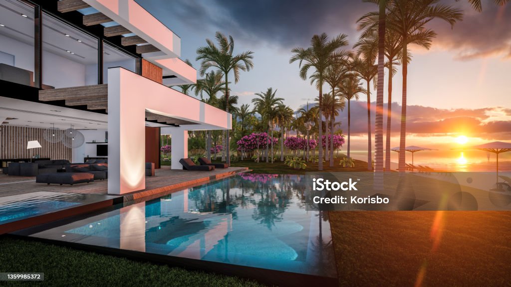 3d rendering of modern house in luxurious style by the sea or ocean on sunset 3d rendering of modern cozy house with pool and parking for sale or rent in luxurious style by the sea or ocean. Sunset evening by the azure coast with palm trees and flowers in tropical island Luxury Stock Photo