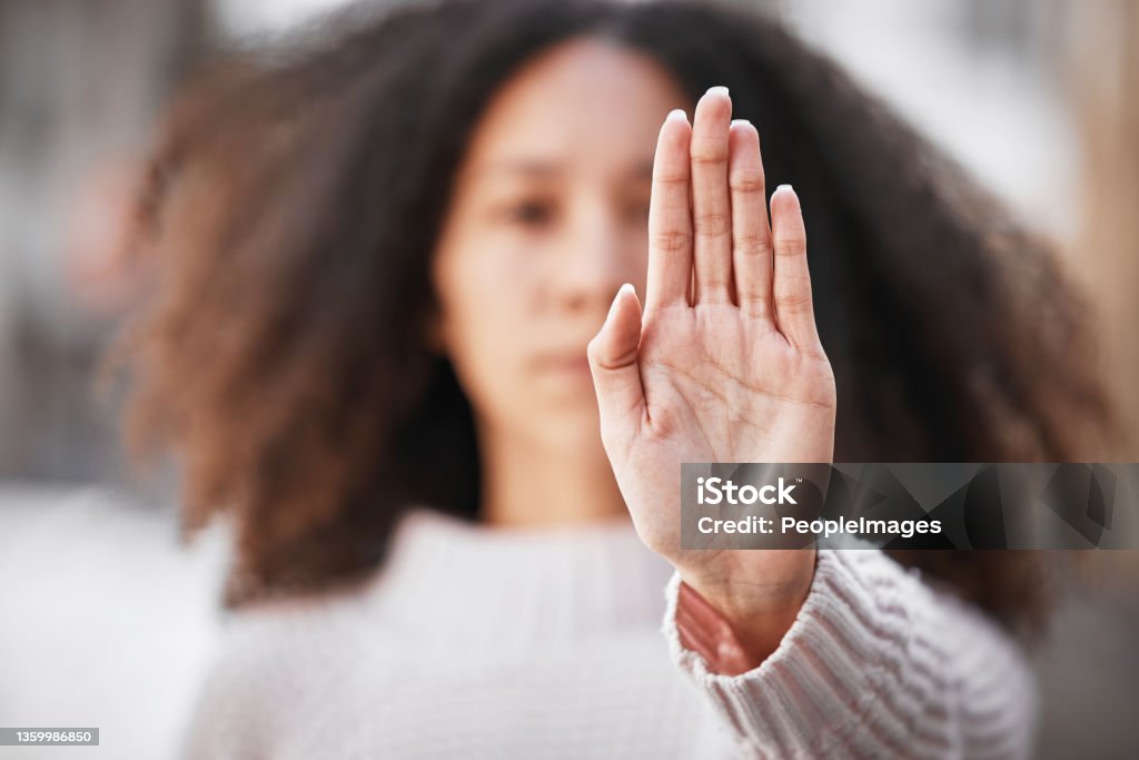 Shot of an unrecognizable woman making the stop sign with her hand outside We need women at all levels Hand Stock Photo