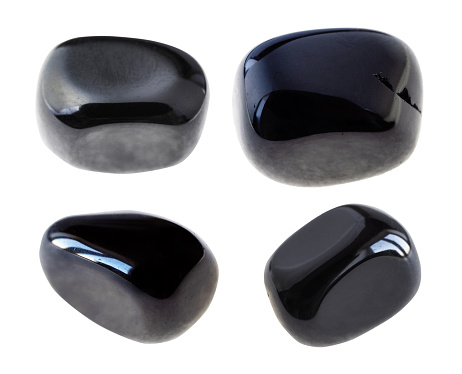 set of various black Onyx gem stones cutout on white background