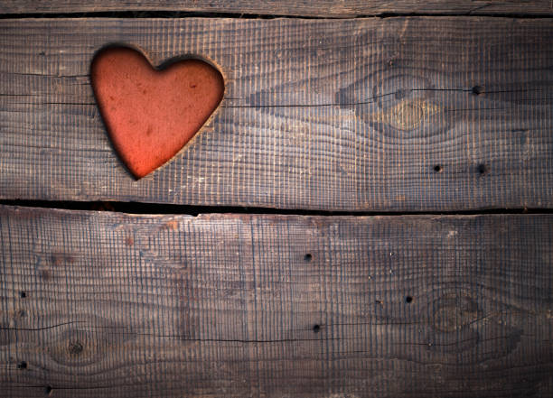Valentine's day concept background . Love text on wooden background