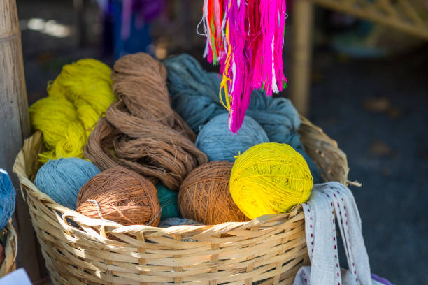 Natural color dye raw cotton thread in bamboo basket, Asian eco product, handicraft material, environment friendly concept