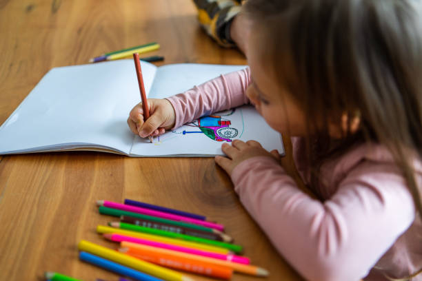 istock Father and daughter drawing together 1359992079