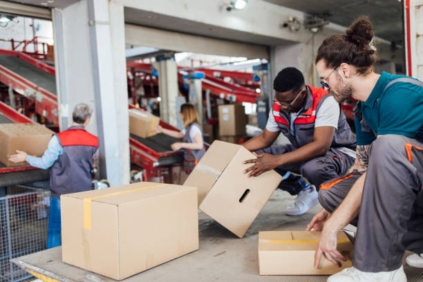 istock Group of workers working at the warehouse 1359992430