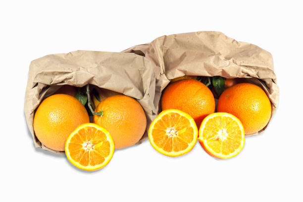 istock yellow meal oranges with recyclable paper bag 1359994559