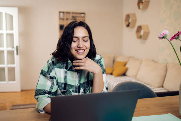 istock Happy, young freelancer working from home 1359994866