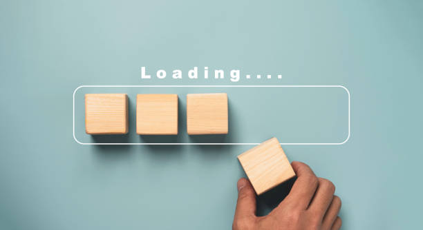 istock Hand putting wooden cube on virtual infographic rectangle block with loading wording for update and job progressive concept. 1359996730