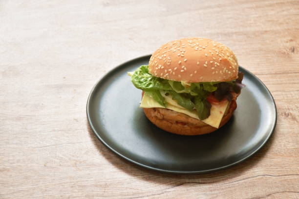 istock fried mashed chicken cheese hamburger and lettuce stuffed mayonnaise sauce with ketchup 1359998065