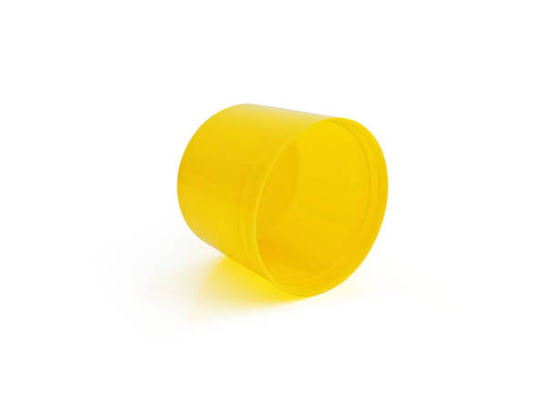 istock Plastic bottle cap isolated. Front view of yellow plastic plug. Yellow cap isolated on white background. Cap for bottle and plastic containers. 1359999496
