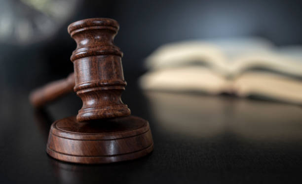 justice and law concept over black wooden