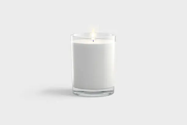 Photo of Blank white pillar candle in glass jar mockup, gray background