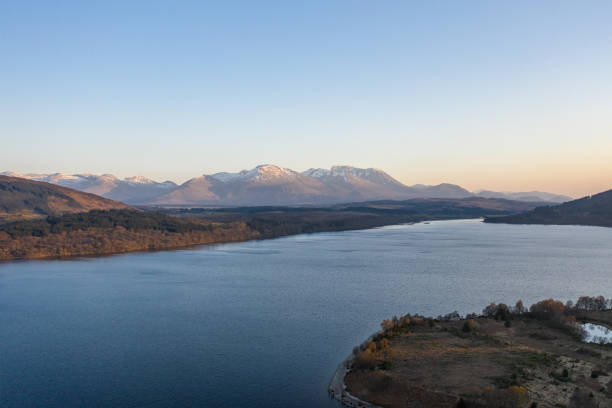 istock Scottish Loch and Mountain Landscape at Sunset 1360001087