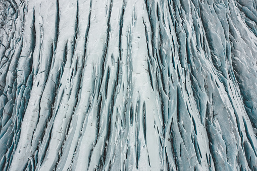 Deep crevices and slices of an active glacier in Iceland which are being affected by global warming