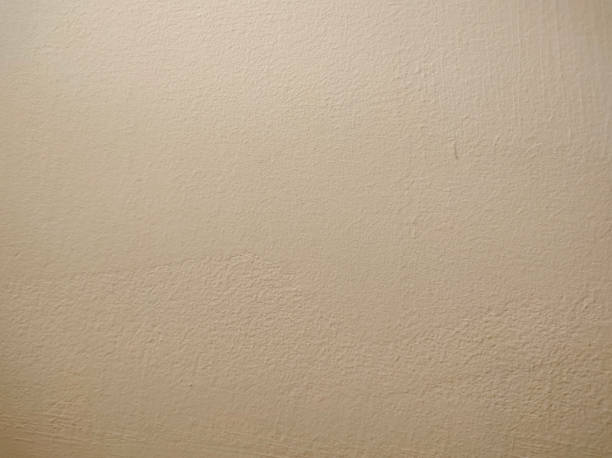 istock Vintage Beige Paint Wall Background Texture 1360003331