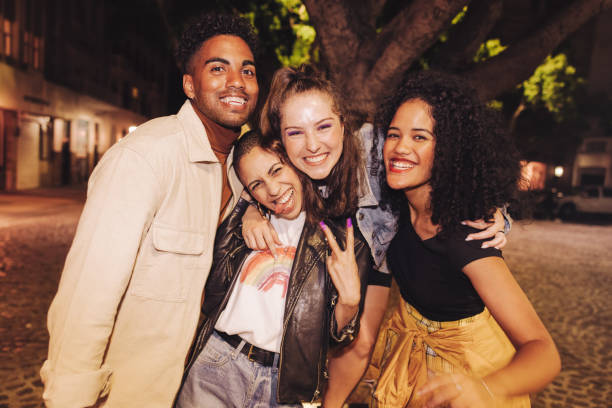 istock Group of friends smiling at the camera cheerfully 1360003744