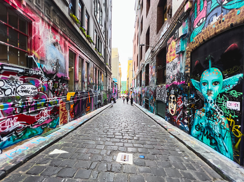 Melbourne, Australia - December 10, 2021: Melbourne, the capital of Victoria and the second largest city in Australia, has gained international acclaim for its diverse range of street art and associated subcultures. Overlooking a graffiti painted alley in Melbourne, Australia.