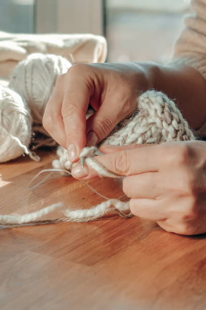 istock Knitting.Recycling, environmental friendliness, zero waste, recycling, friendly,Knitted sweater and threads for knitting from yarn, Cozy knitting, small business 1360006051