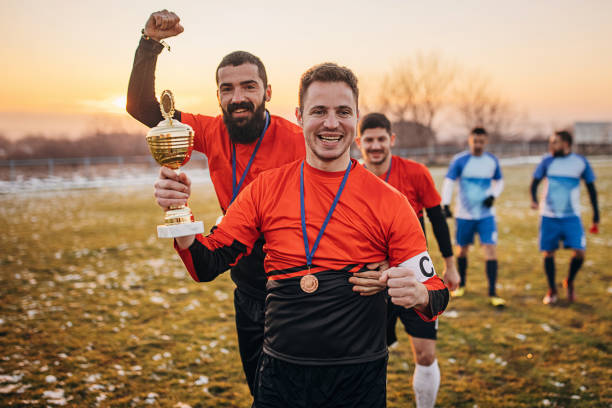 istock Football team won a trophy 1360006297