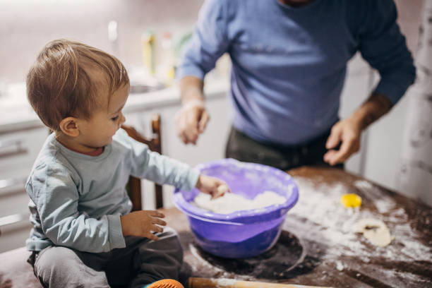 istock Grandfather and grandson in the kitchen 1360006578