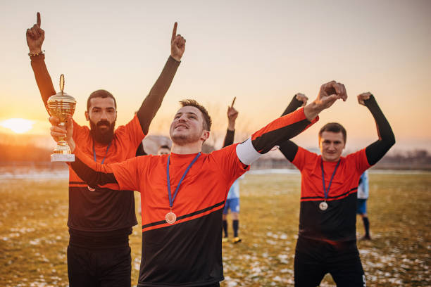istock Football team won a trophy 1360007602