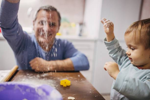istock Grandfather and grandson in the kitchen 1360008005