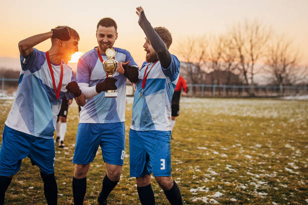 istock Football team won a trophy 1360008565