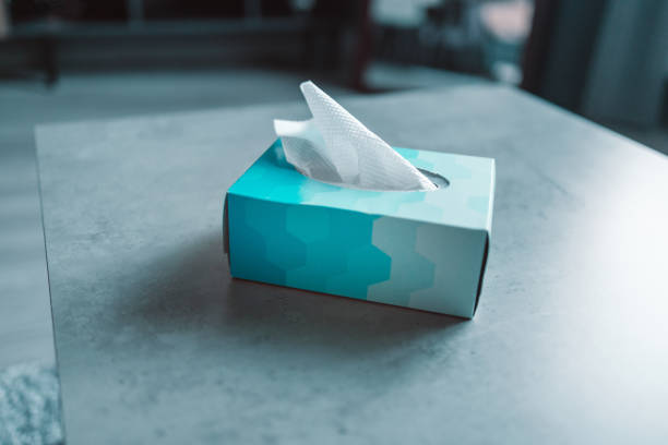istock Blue tissue box on grey table background at home bedroom 1360008792
