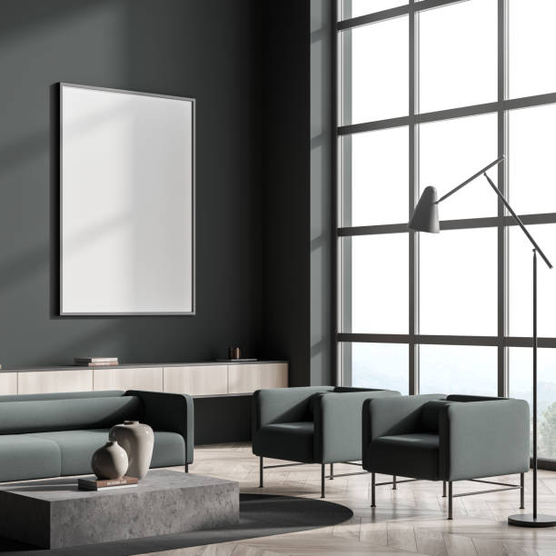 istock Dark living room interior with empty white poster, sofa 1360008820